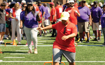 An athlete jumps over hurdles during the CSS Consumer Olympics.